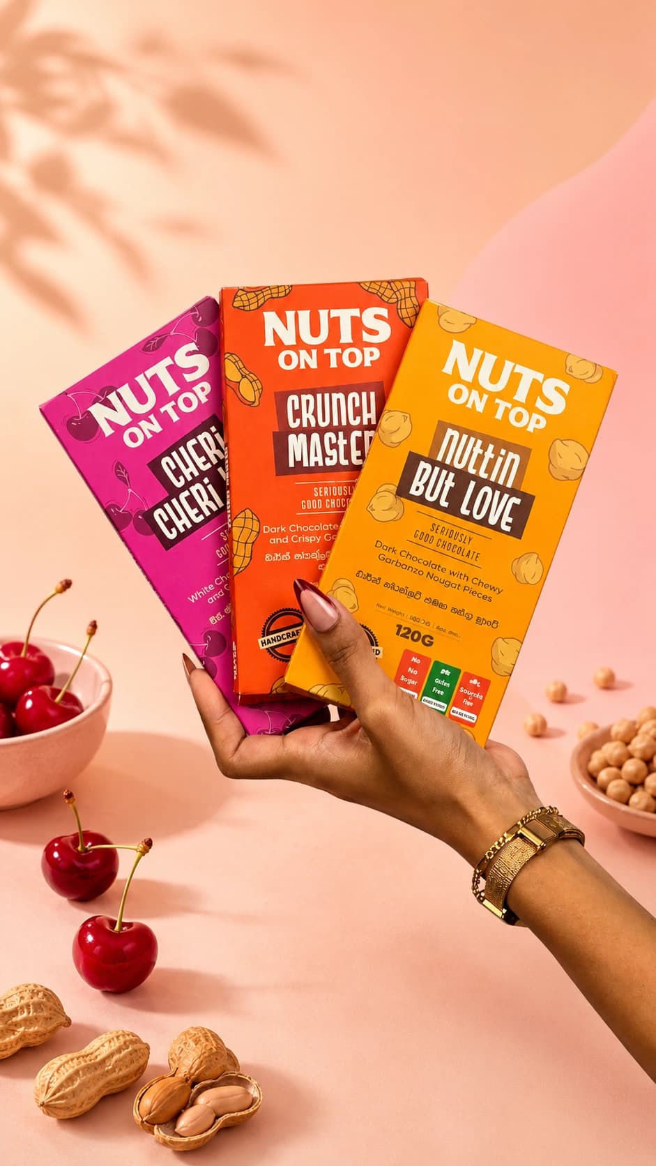 Hand-tempered chocolate bars cooling on a warm marble surface with cacao nibs and spices